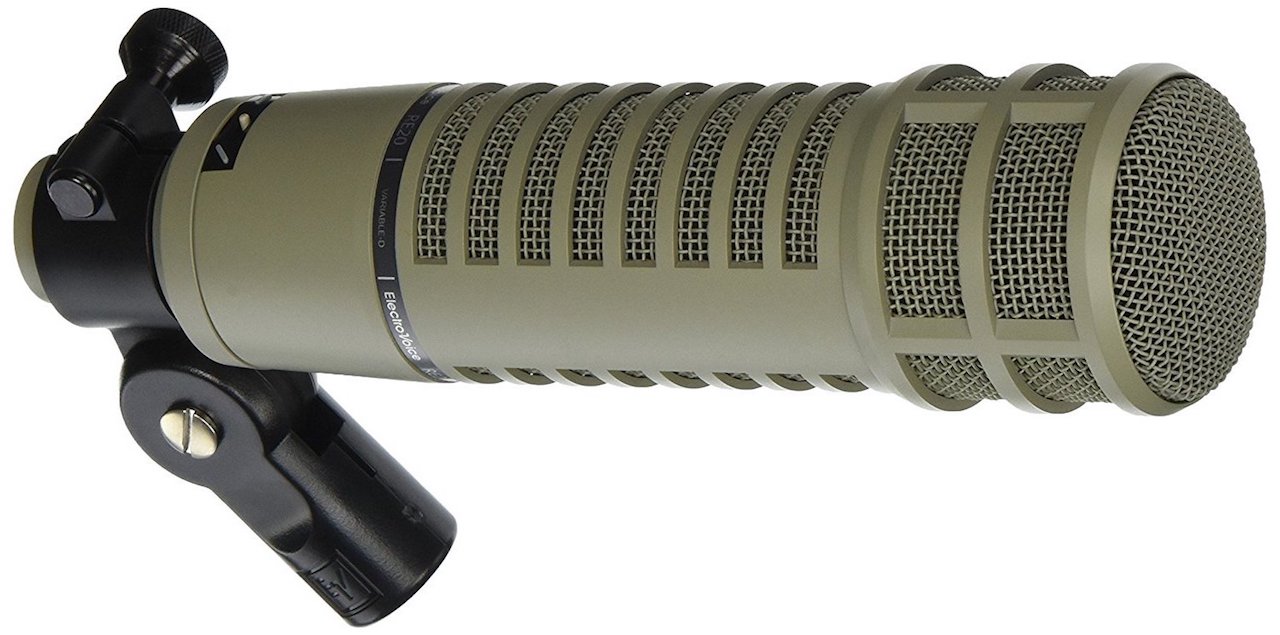 This is a long khaki and silver Electrovoice RE20 microphone against a plain white background. The microphone is horizontal.